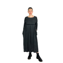 Load image into Gallery viewer, Martha dress pattern view B on model in black and white grid viscose fabric - tapered sleeves, three shallow inverted pleats on skirt, front view, hands in pockets