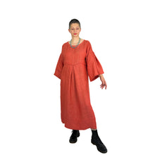 Load image into Gallery viewer, Martha dress pattern view A on model in heavyweight coral linen - wide sleeves, deep pleats, full front view