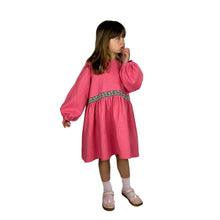 Load image into Gallery viewer, Finished May dress on model, shown in coral pink linen with daisy trim
