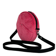 Load image into Gallery viewer, minnie bag sewing pattern by dhurata davies, side view of the round bag in pink velvet fabric and a black strap