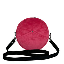 Load image into Gallery viewer, minnie bag sewing pattern by dhurata davies, front view of the round bag in pink velvet fabric and a black strap