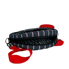Load image into Gallery viewer, minnie bag sewing pattern by dhurata davies, open zipper view of round bag made in stripy denim fabric, showing the white and black gingham lining inside