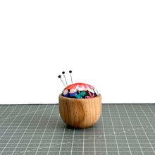 Load image into Gallery viewer, a handmade pincushion in liberty fabric on a wooden base, three pins on it, cute floral fabric, tresco