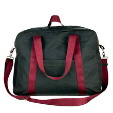 Load image into Gallery viewer, rome weekender - travel bag sewing pattern by dhurata davies, made in a dark taupe waxed cotton fabric with burgundy webbing. front view showing front pocket, handles and shoulder strap