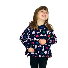 Load image into Gallery viewer, Front view of playful child wearing Wren Pullover View A hoodie in multicolour floral fabric, laughing.