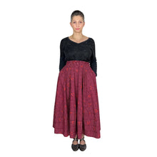 Load image into Gallery viewer, Ziggy Skirt sewing pattern by Dhurata Davies, front view with hands in pockets, cerise and burgundy poplin fabric