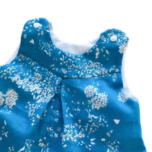 Load image into Gallery viewer, penny romper sewing pattern for babies and toddlers, by dhurata davies,  detail view of the top of the romper made in a blue and white floral fabric