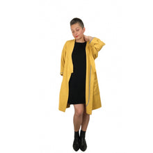 Load image into Gallery viewer, The Overlap sewing pattern by dhurata davies, front open view of the yellow long version, showing details of the hong kong bound facing on the front and sleeves