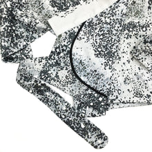Load image into Gallery viewer, The Overlap sewing pattern by dhurata davies, flat lay of the speckled grey short version, showing inside details of the hong kong bound facing
