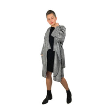 Load image into Gallery viewer, The Overlap sewing pattern by dhurata davies, front open view of the black and white long version, showing a detail of the hong kong bound facing