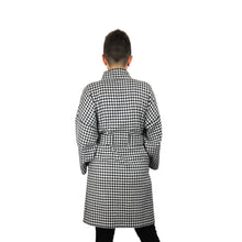 Load image into Gallery viewer, The Overlap sewing pattern by dhurata davies, back view of the black and white long version, hands in front pockets