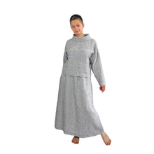 Load image into Gallery viewer, Edith sewing pattern – front view of top and skirt, top untucked, right hand hidden behind back, left foot out to the side
