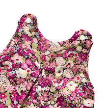 Load image into Gallery viewer, penny romper sewing pattern for babies and toddlers, by dhurata davies,  detail view of the top of the romper made in a pink white and green floral fabric