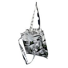 Load image into Gallery viewer, twin tote, bag sewing pattern by dhurata davies, hanging from one handle, showing the inside structure of the bag compartments. made in an abstract tree design on a white background