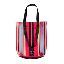 Load image into Gallery viewer, A striped canvas Hattie tote bag with vibrant pink, red, orange, purple, and blue vertical stripes, featuring black shoulder straps and a small metal buckle detail.