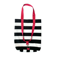 Load image into Gallery viewer, A canvas tote bag with bold black and white horizontal stripes and bright pink handles, shown against a plain white background.