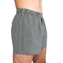 Load image into Gallery viewer, Man wearing the Hugo Boxers sewing pattern in black and white gingham, side view