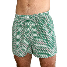 Load image into Gallery viewer, Man wearing the Hugo Boxers sewing pattern in green clover print, front view