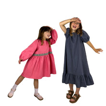 Load image into Gallery viewer, finished May dress, view B in coral pink linen with bishop sleeves, and view A in grey linen, fun pose